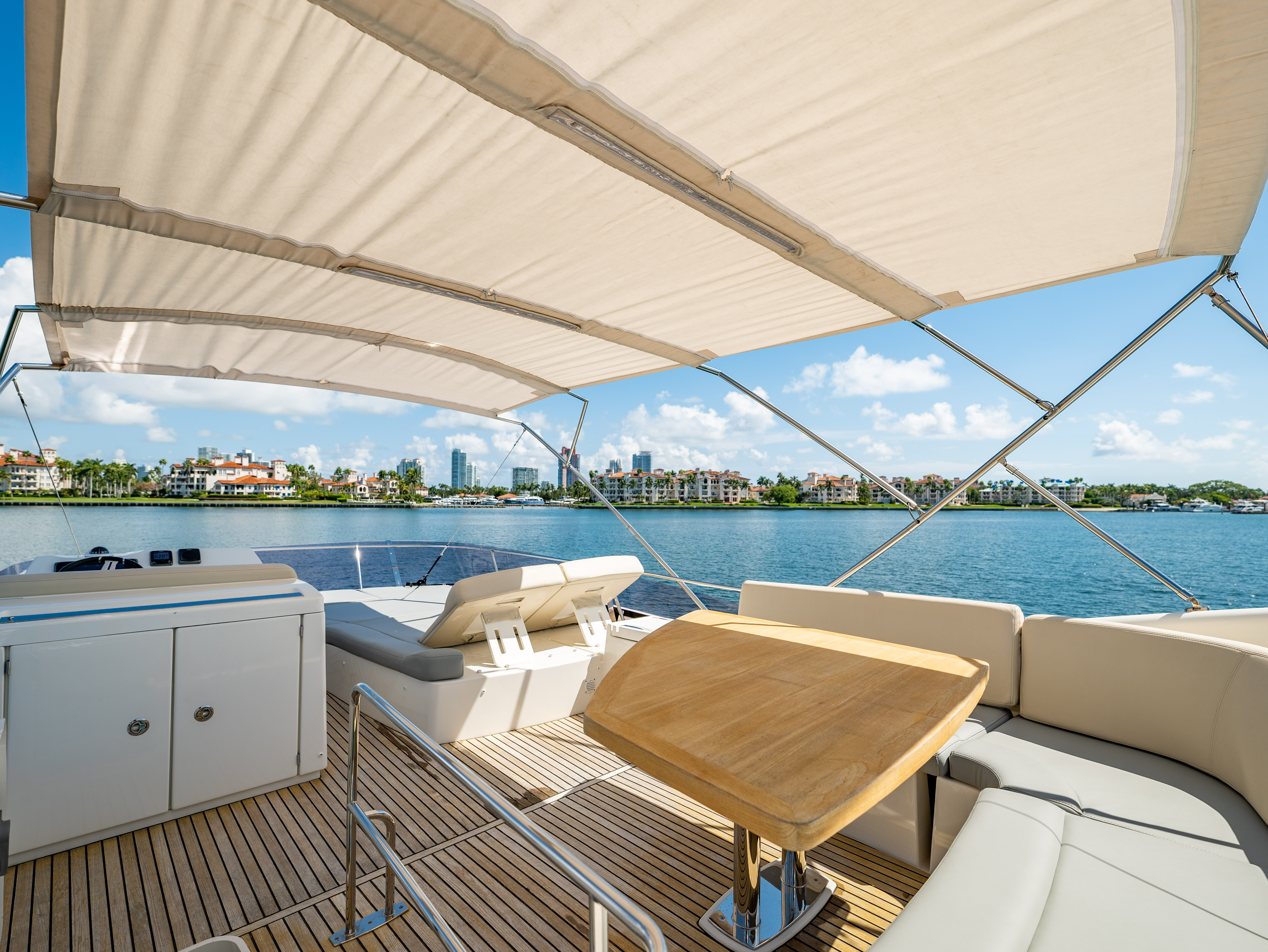 52ft Prestige (2017) - Bimini yacht rental Miami - bow seating area perfect for sunbathing and relaxation