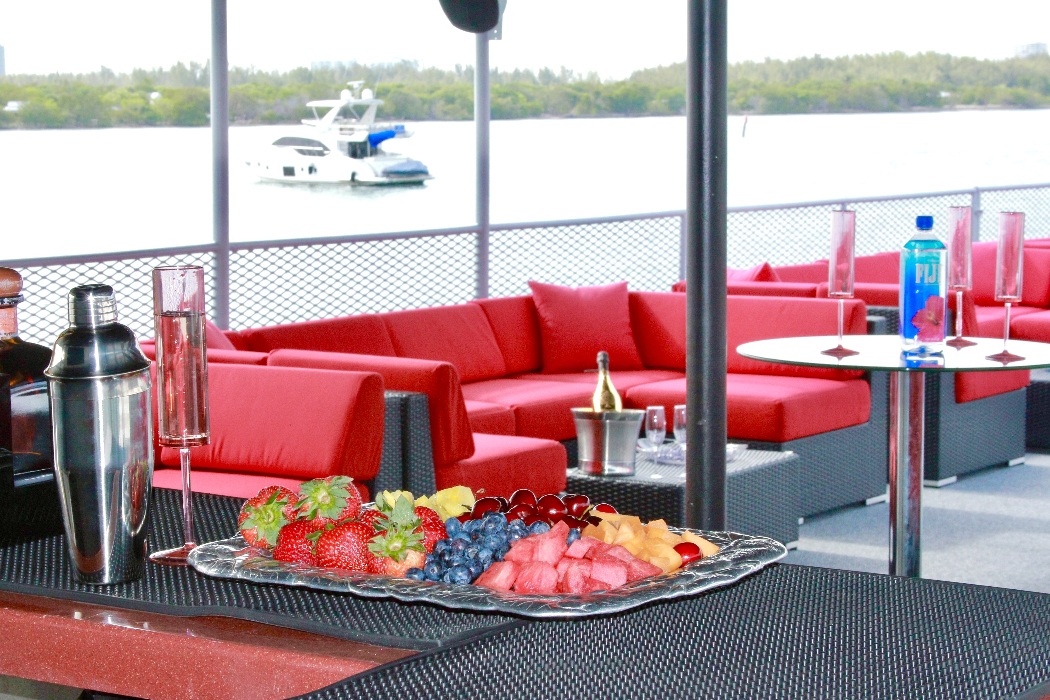 115ft Upus yacht rental Miami - comfortable lounge area for group celebrations