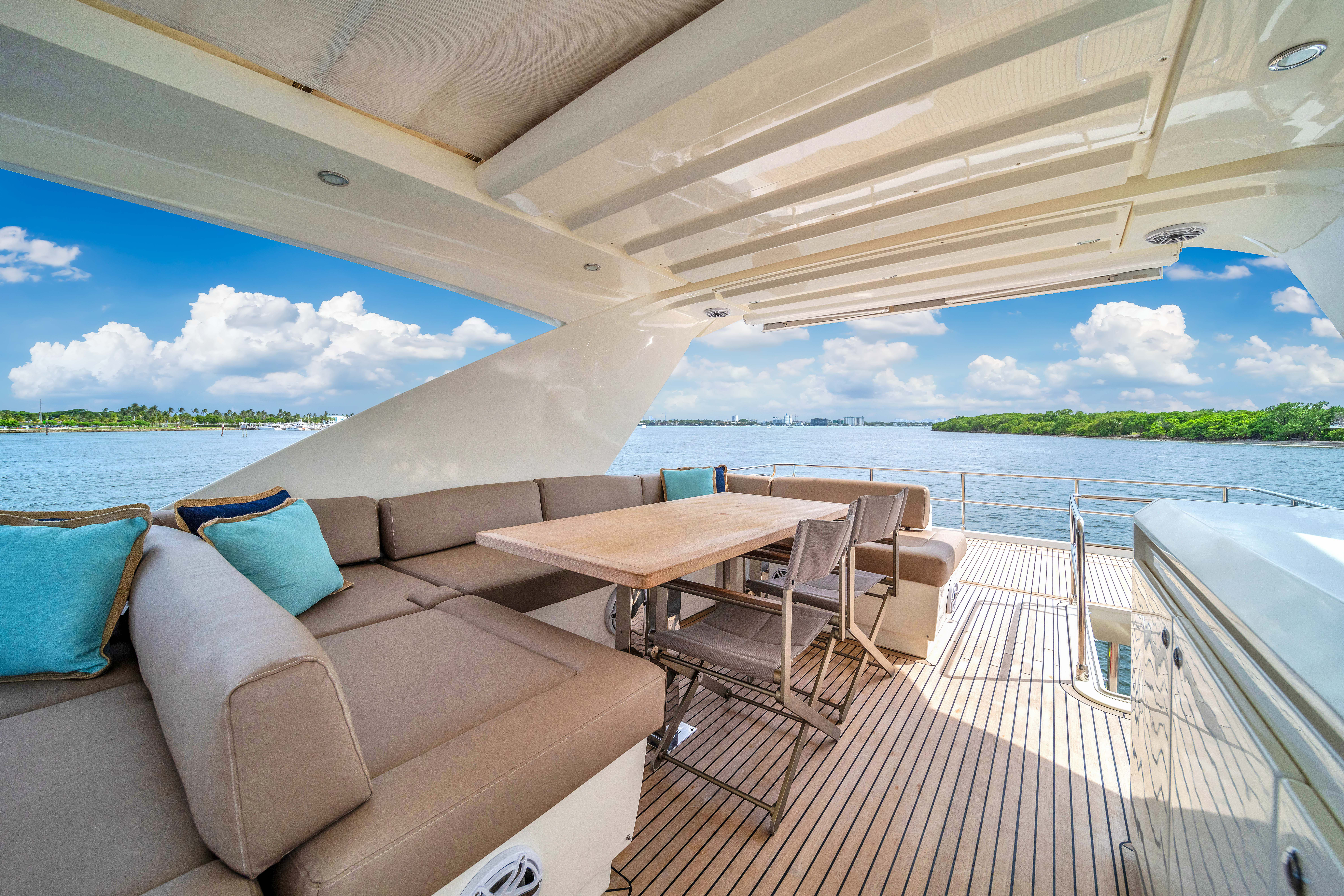 75ft Prestige yacht rental Miami - comfortable lounge area for group celebrations