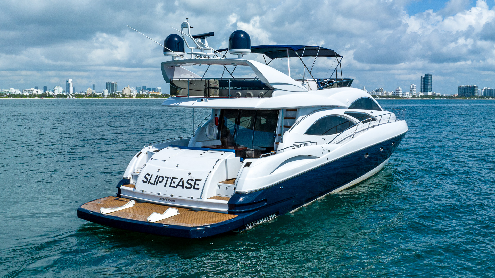 80ft Sunseeker yacht rental Miami - flybridge with panoramic views of Miami skyline