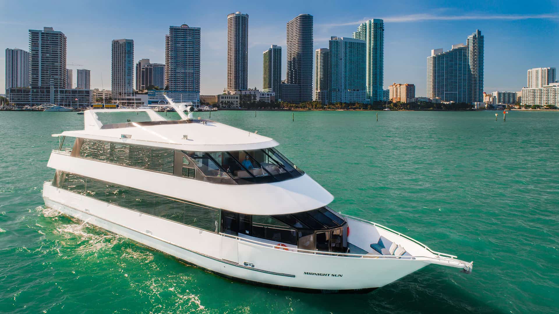 100ft Midsun yacht rental Miami - flybridge with panoramic views of Miami skyline