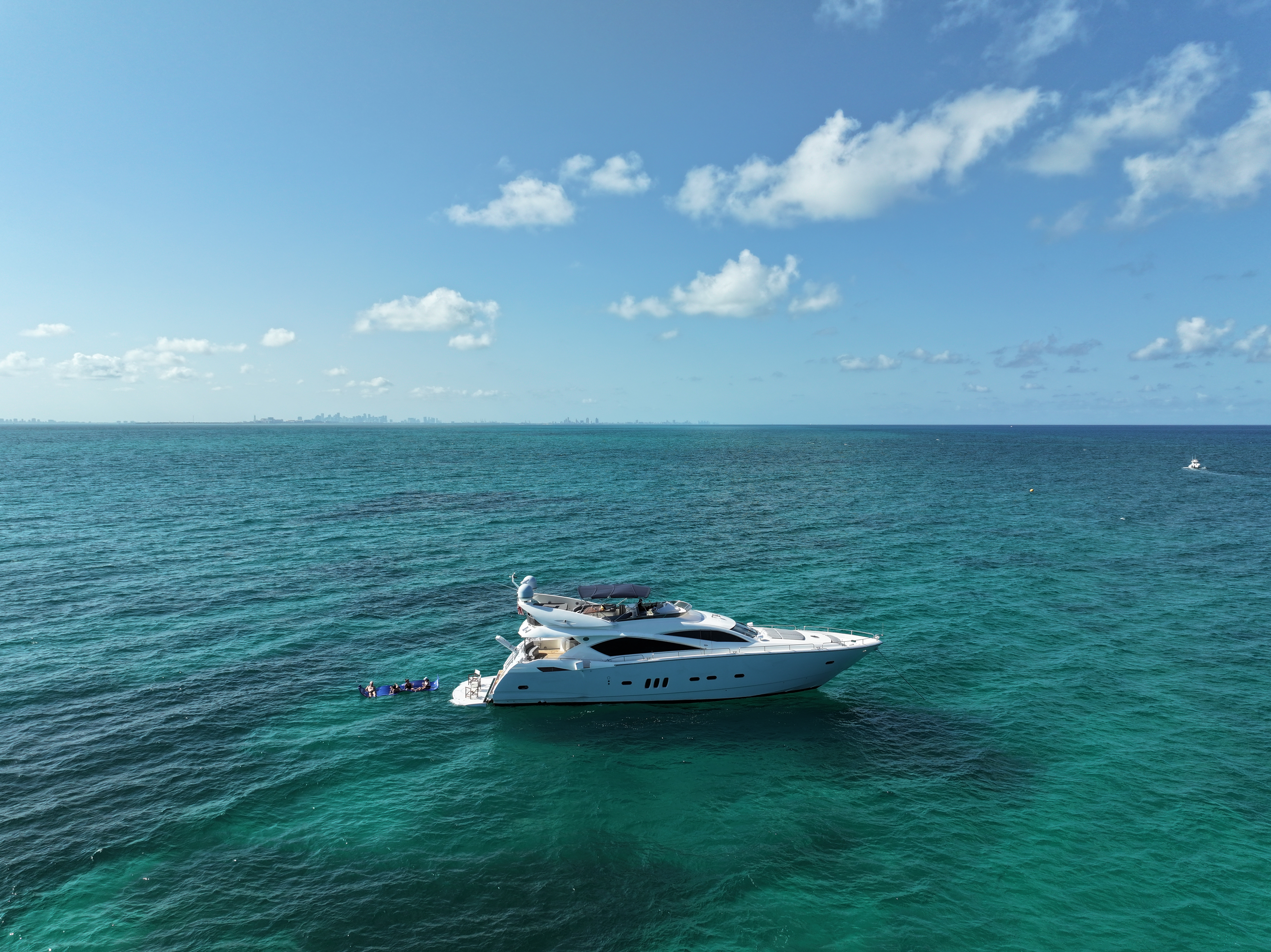 90ft Sunseeker DP yacht rental Miami - flybridge with panoramic views of Miami skyline