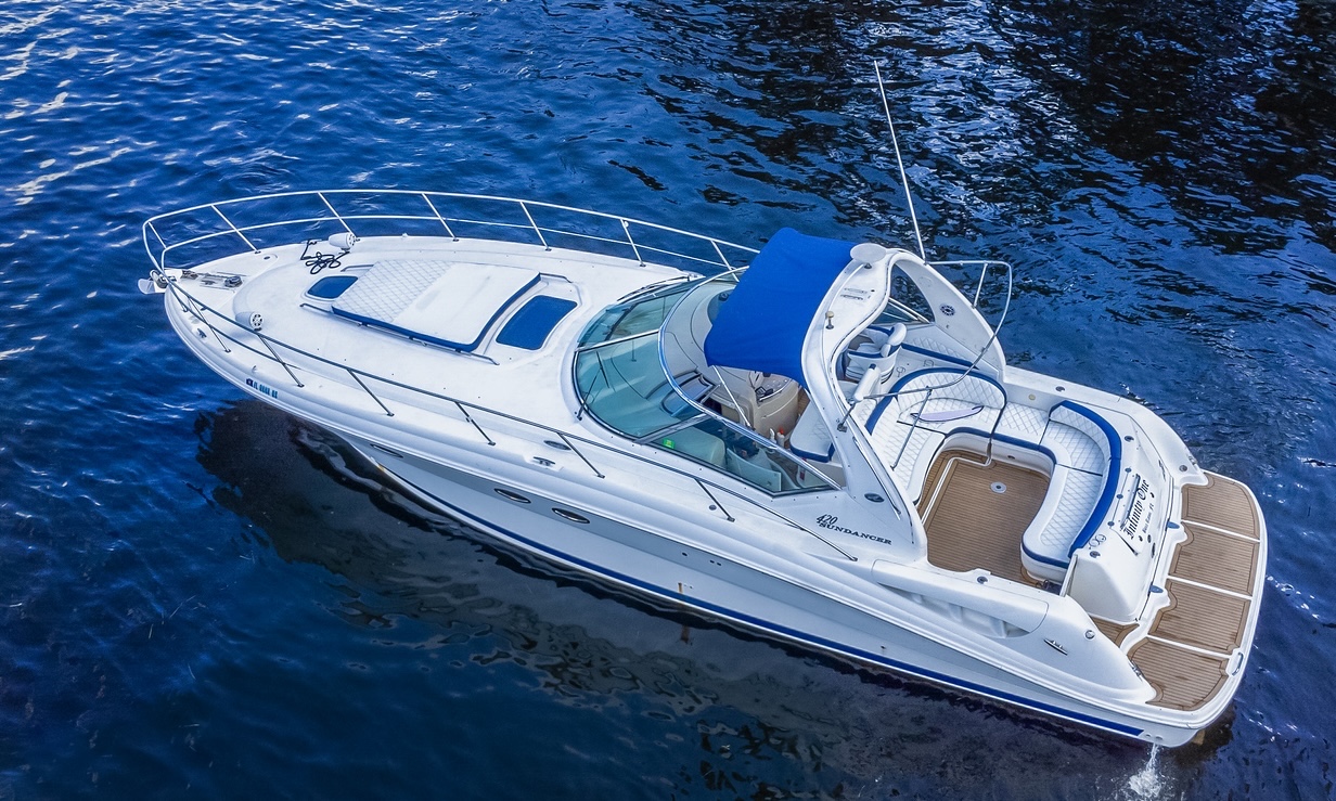 50ft Sundancer yacht rental Miami - flybridge with panoramic views of Miami skyline