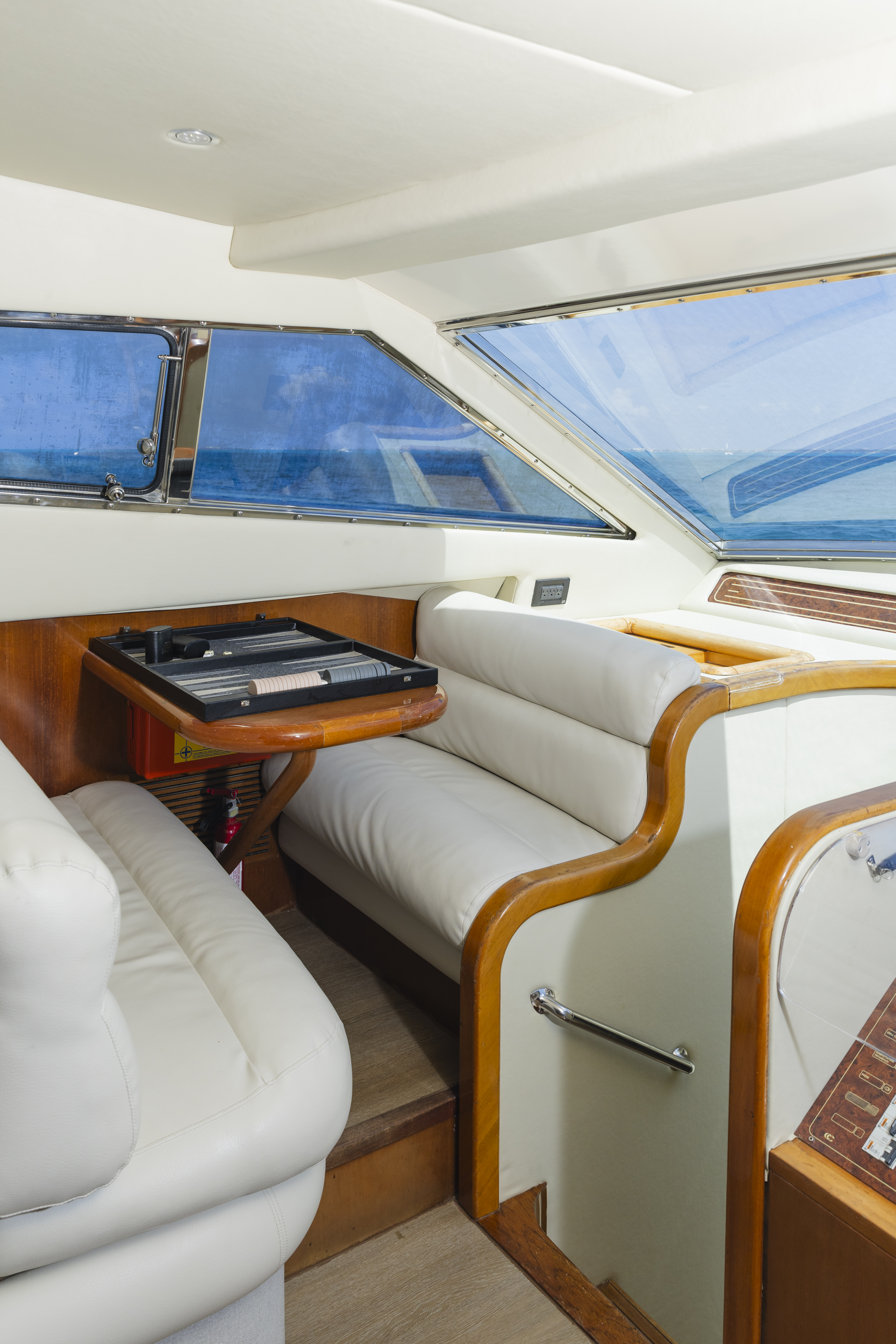 74ft Ferretti yacht rental Miami - elegant interior salon for corporate events and private gatherings